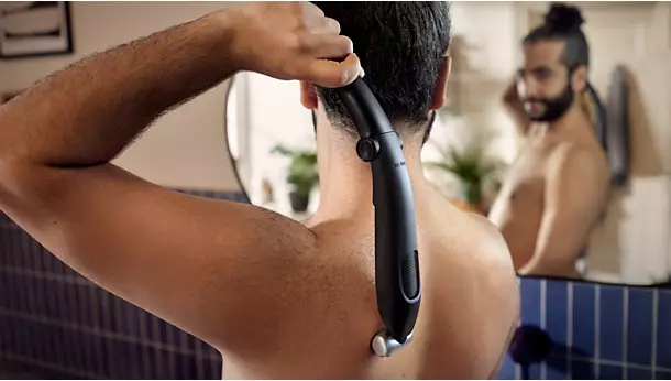 Trimming back hair with the Norelco Bodygroom 5000.